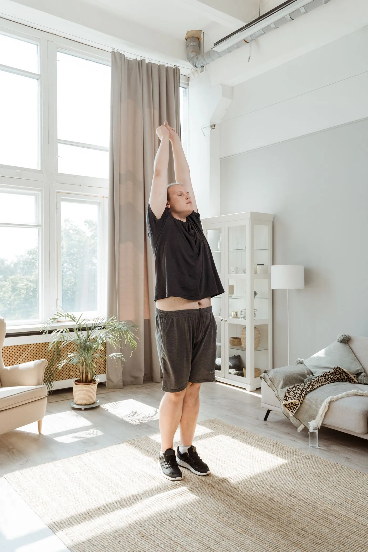 A person stretching gently in a calm room